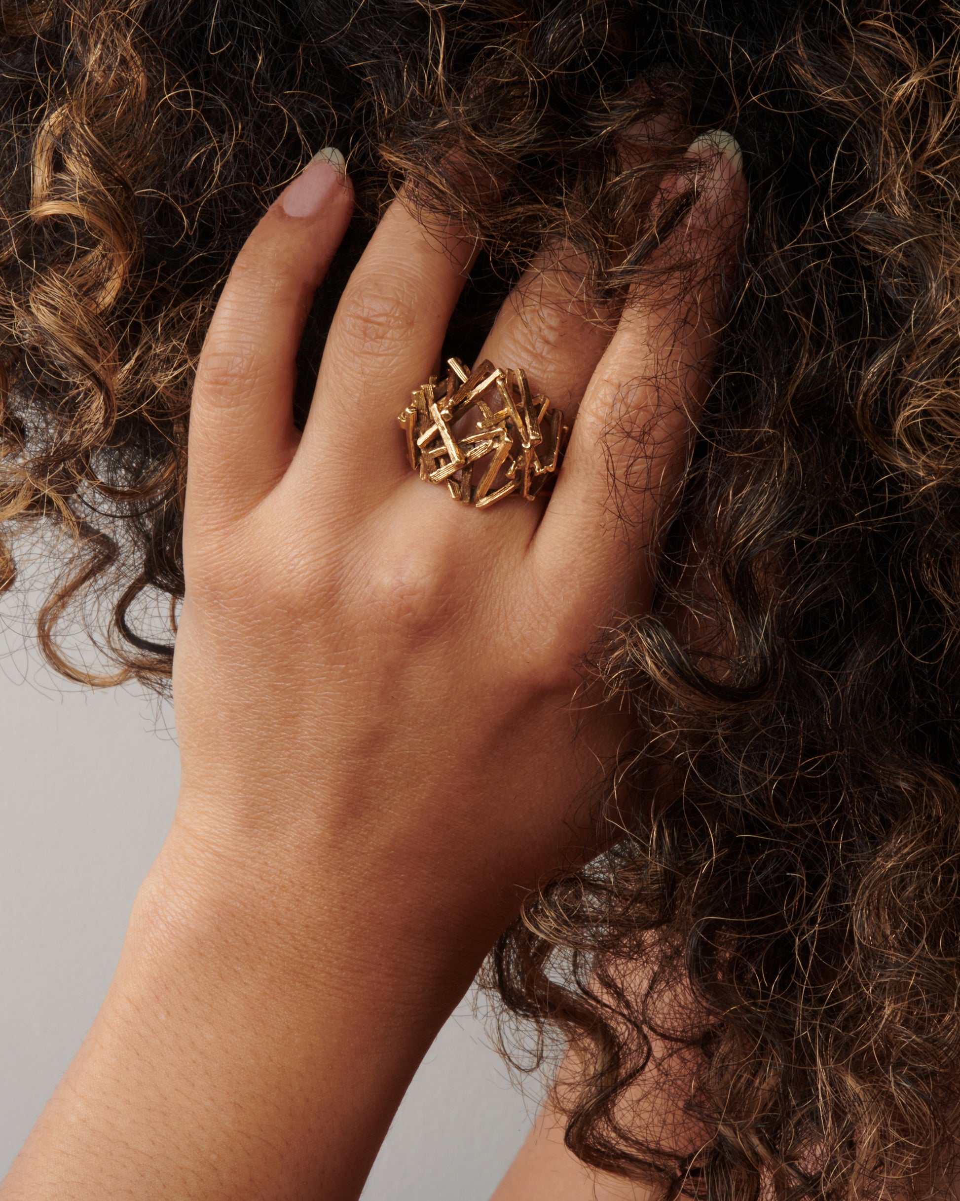 A vintage 15k gold pile of sticks ring that sits high above your finger in an incredible 3D dome