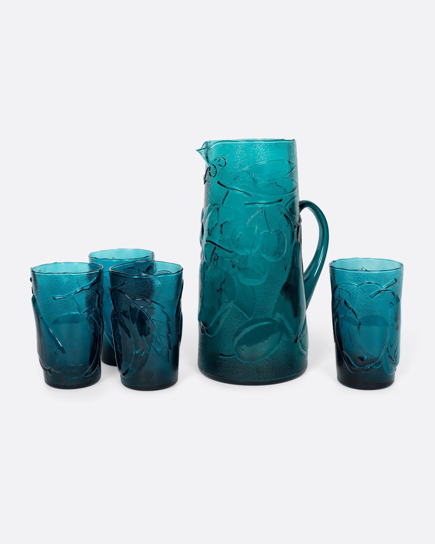 This teal glass set has a subtle fruity texture.