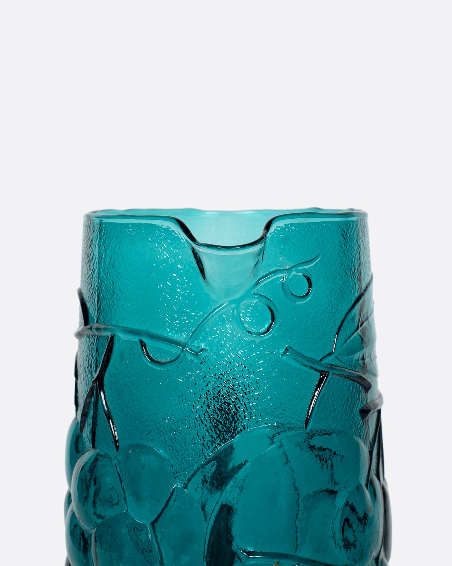 This teal glass set has a subtle fruity texture.