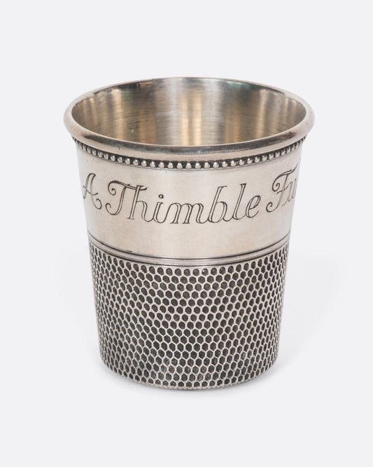 This rare sterling silver vintage shot glass is engraved with "Only a thimble full". A cheeky, yet elegant addition to any bar.