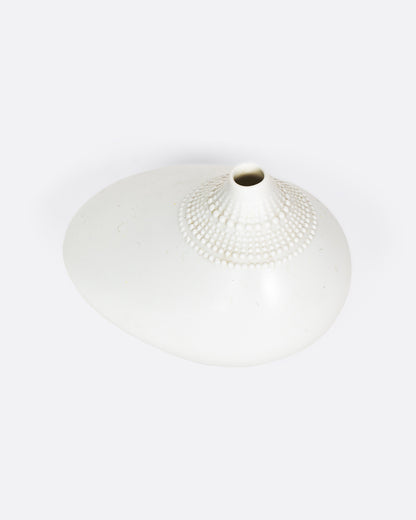 Vintage white porcelain bud vase, view from above showing the opening