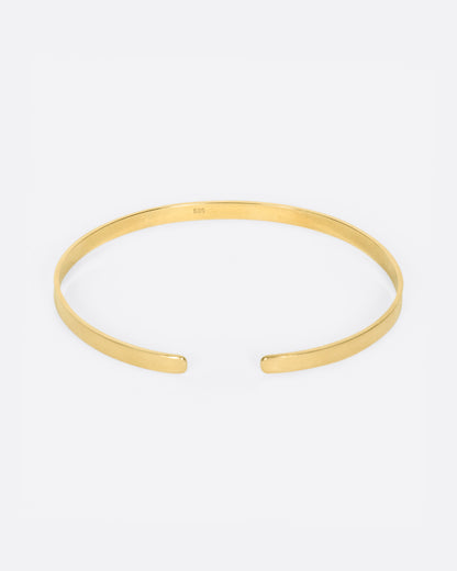 Vintage yellow gold narrow cuff bracelet, front view showing the gap between the ends