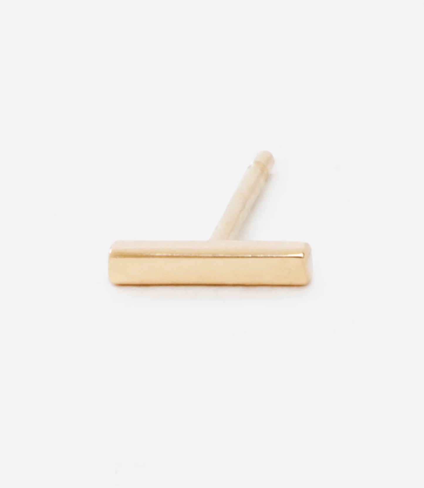 A yellow gold bar earring, shown lying on its side from the front.