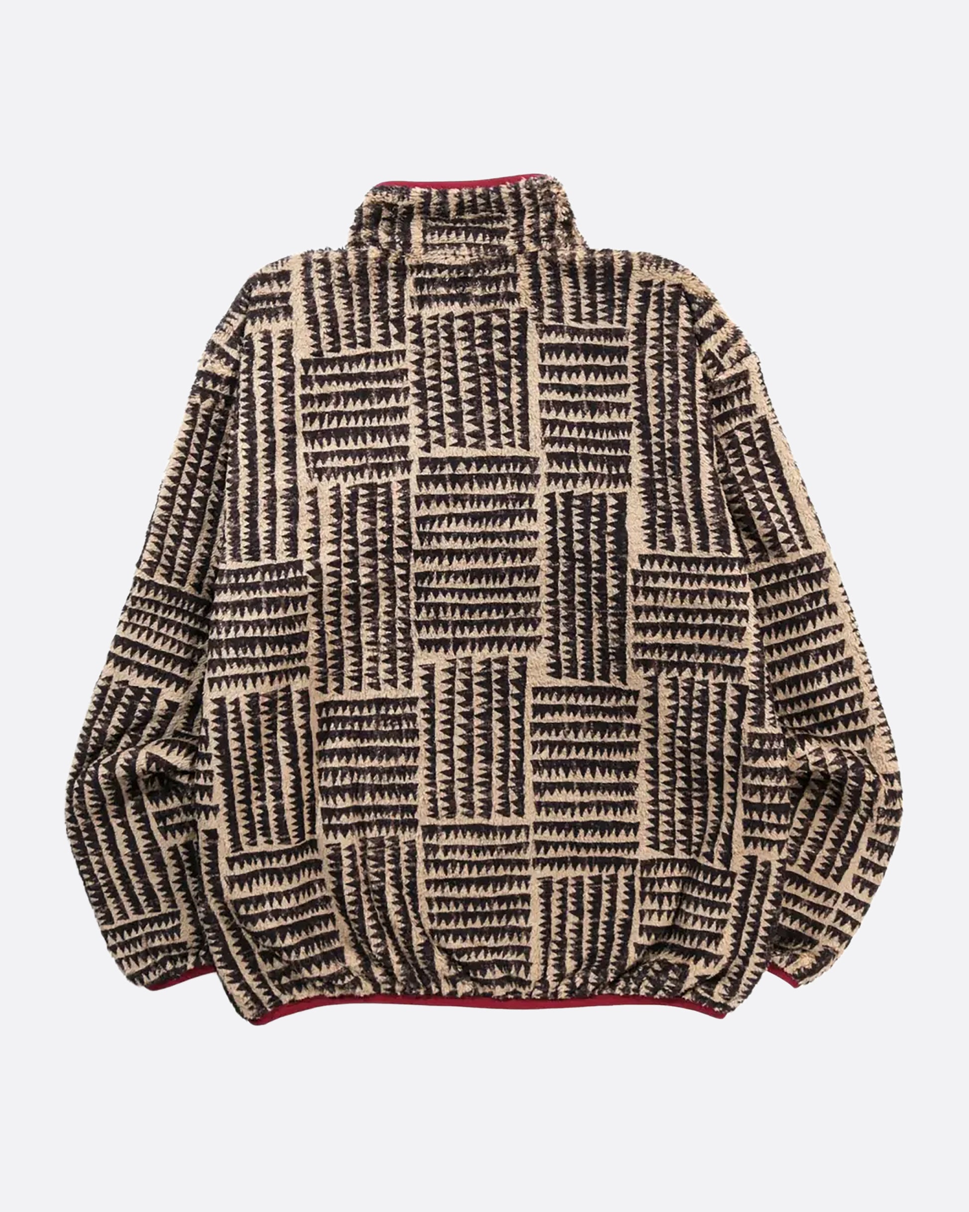 A brown a tan zig zag print fleece pullover with pink detail at the front closure. View from the back laying flat.