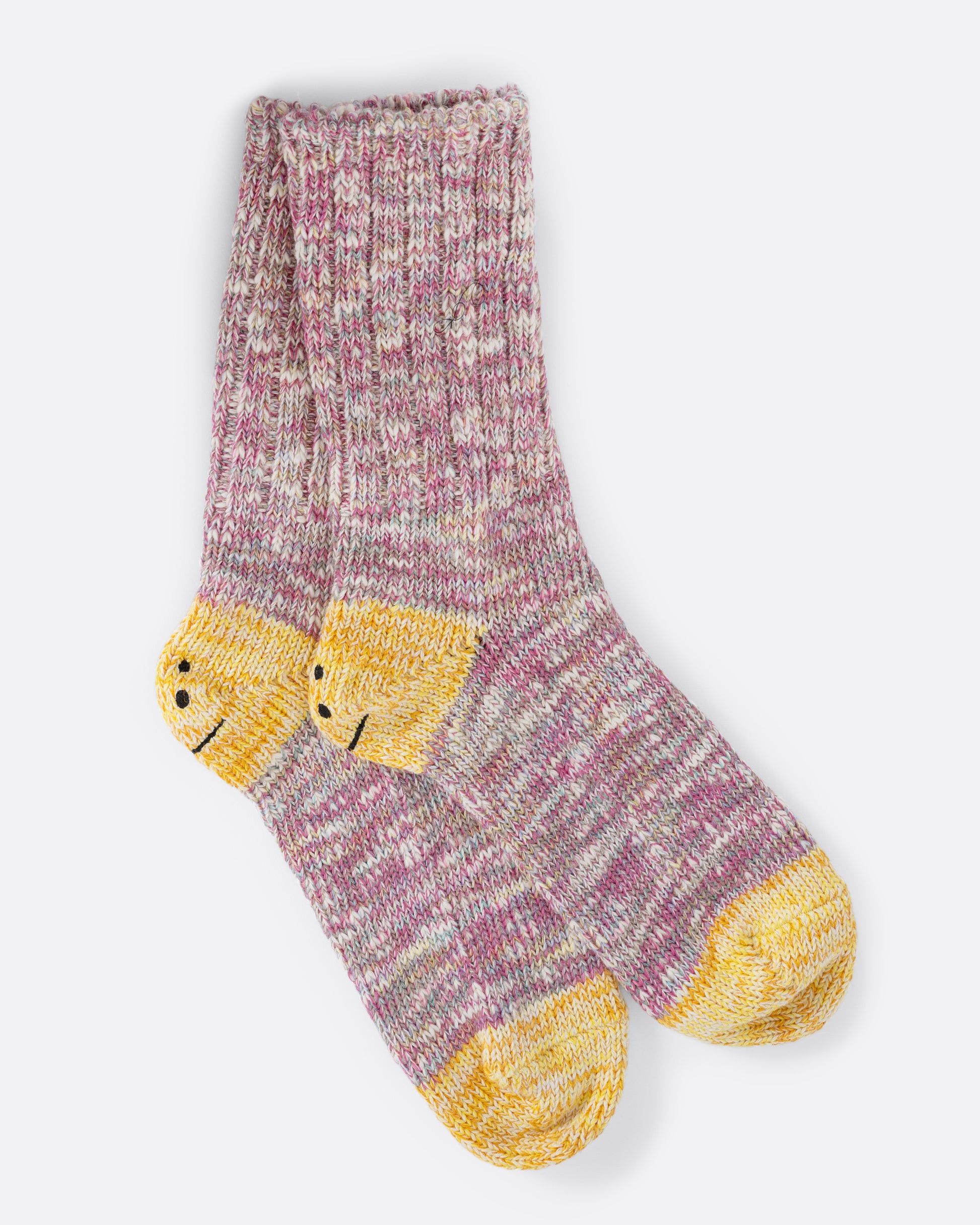 A pair of pink melange socks with yellow smilie heels.