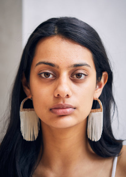 womans ears with hoops in them
