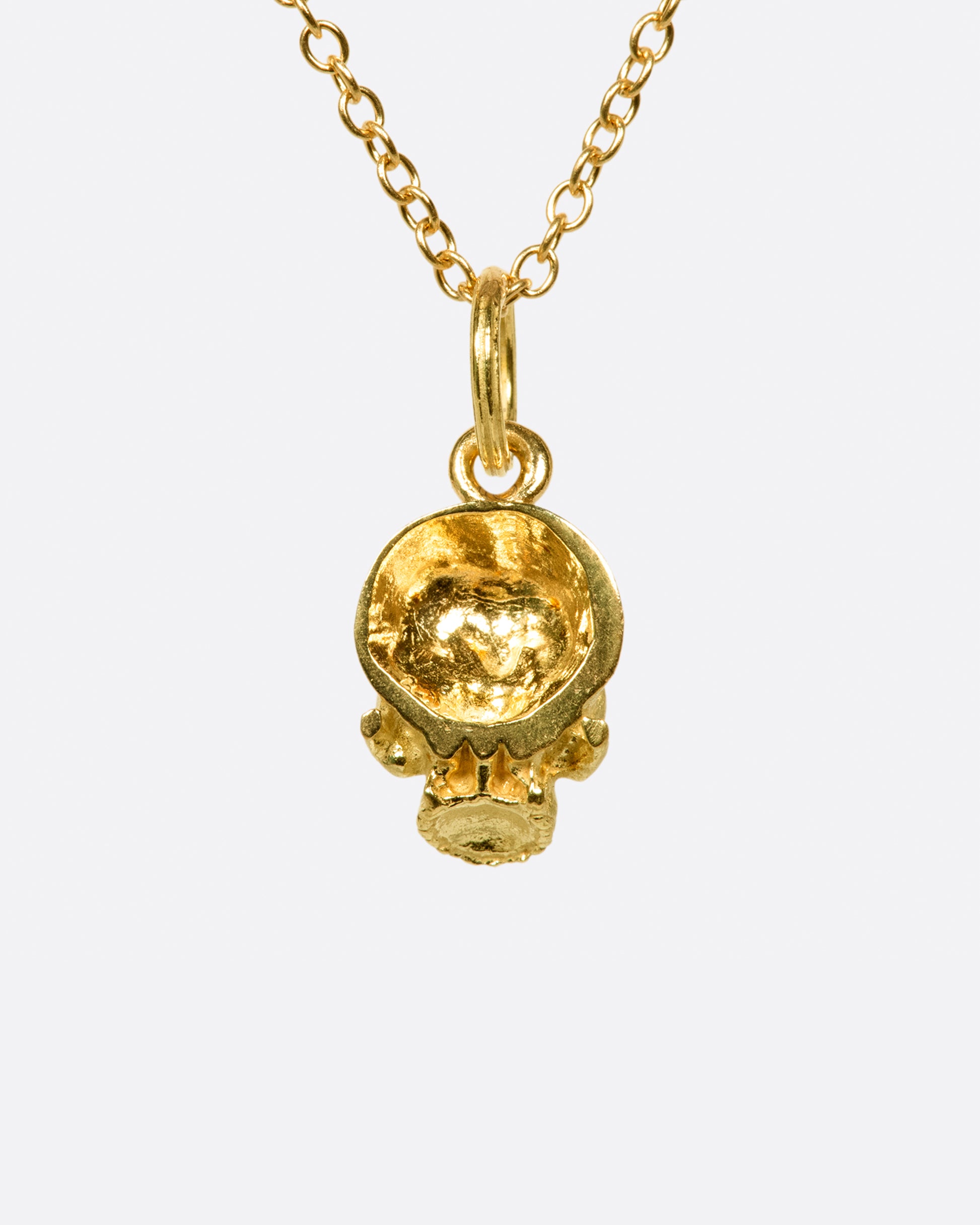 A cable chain necklace with a skull pendant based on the anatomical illustrations of Leonardo Da Vinci.