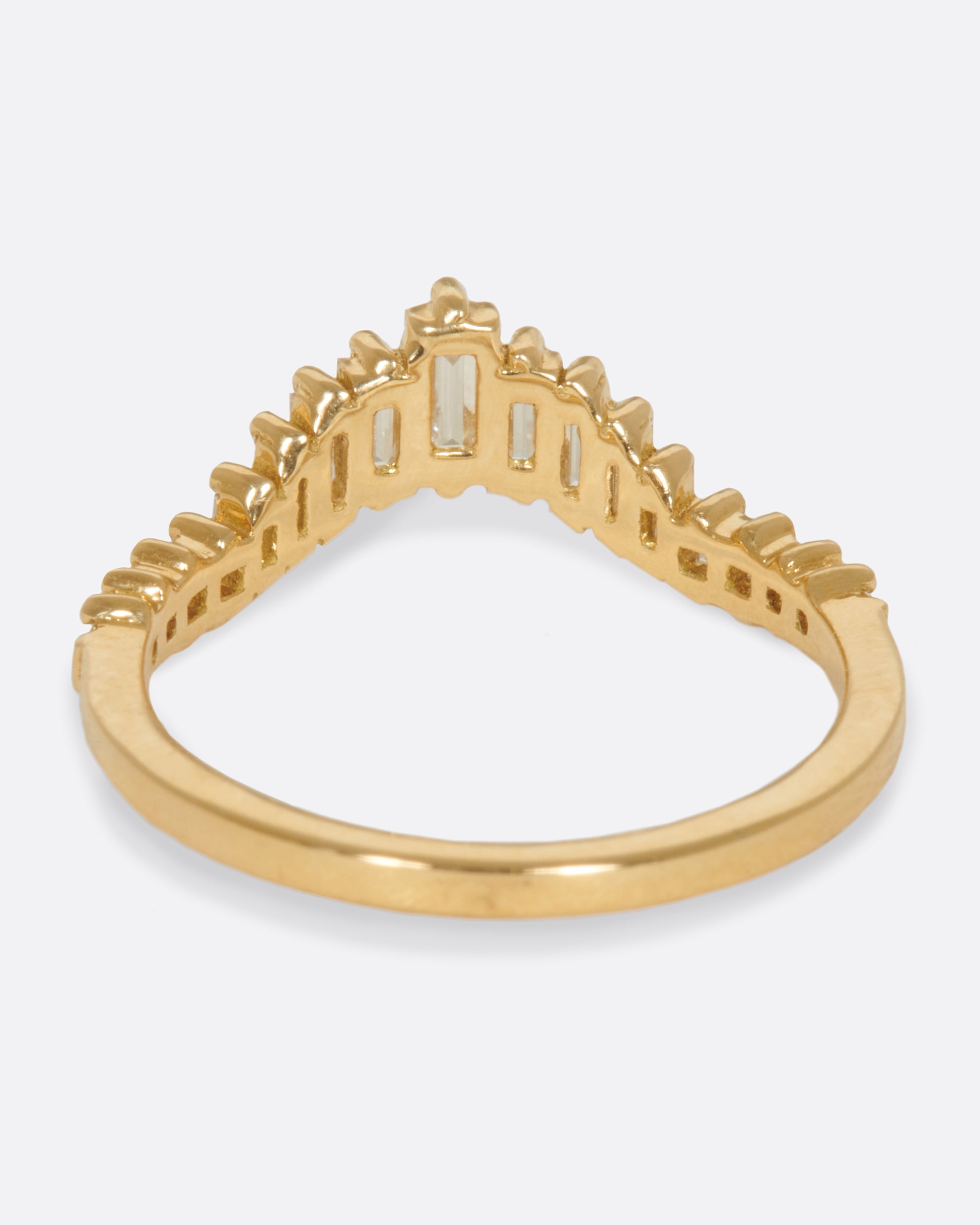 A curved crown ring lined with baguette diamonds.