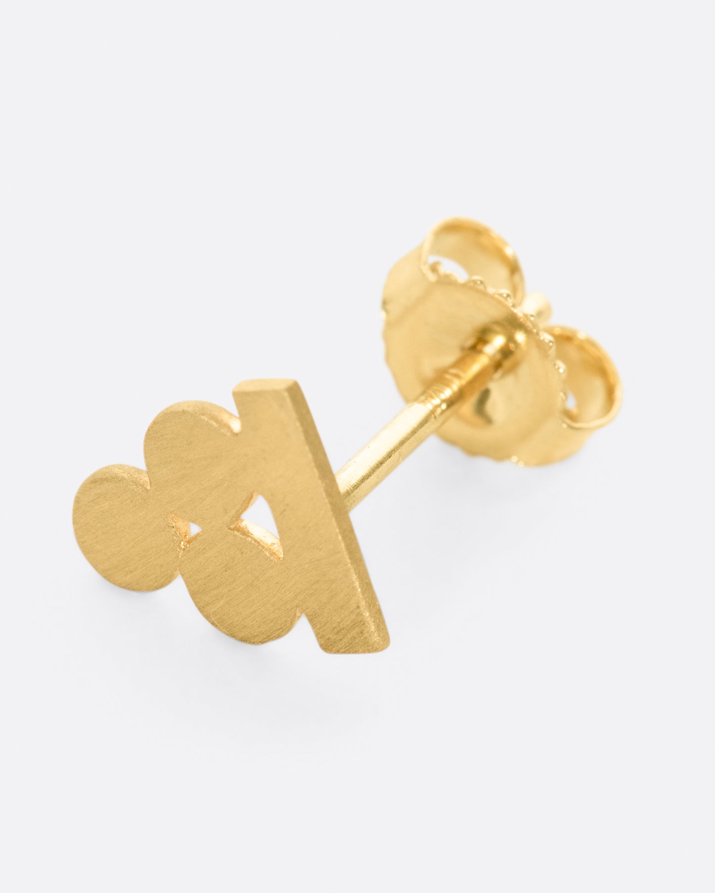 A balancing act, this yellow gold stud earring is comprised of three circles, perfectly in tune with a rectangle.