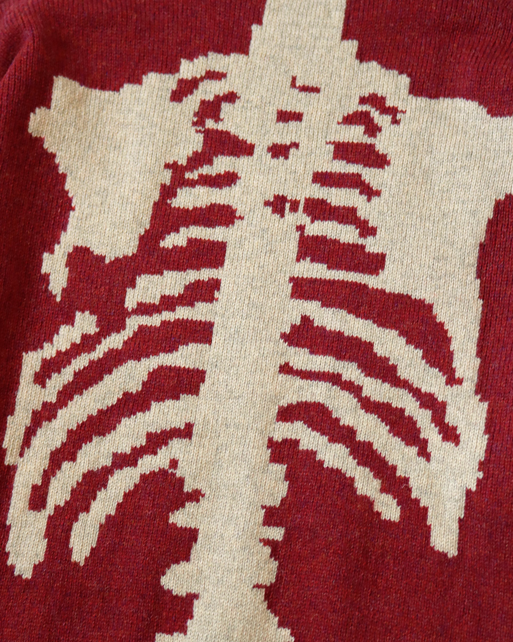 A 5g knit crewneck sweater with Kapital's signature skeletal design.