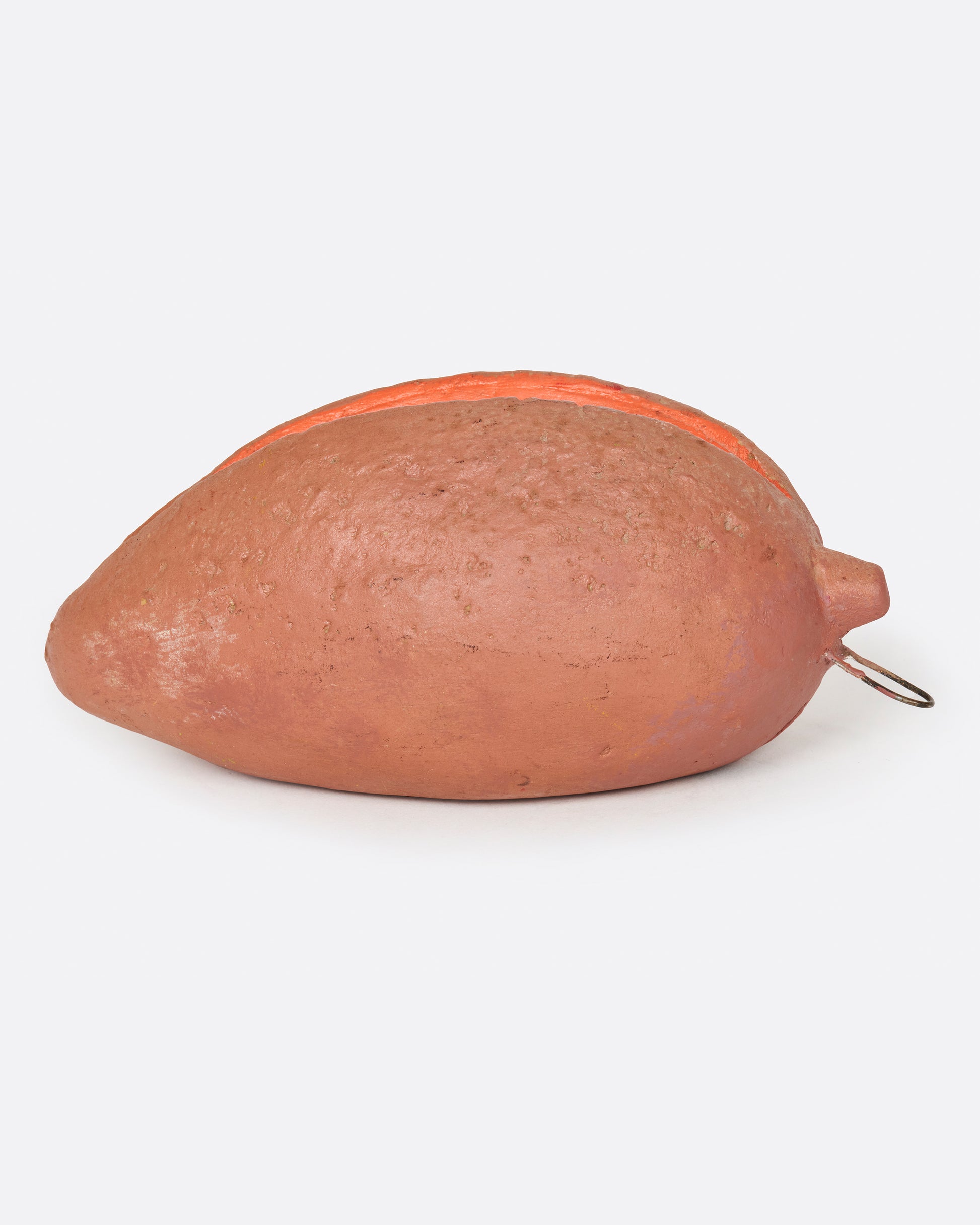 A vintage handmade sapote bank from 1940's Mexico.