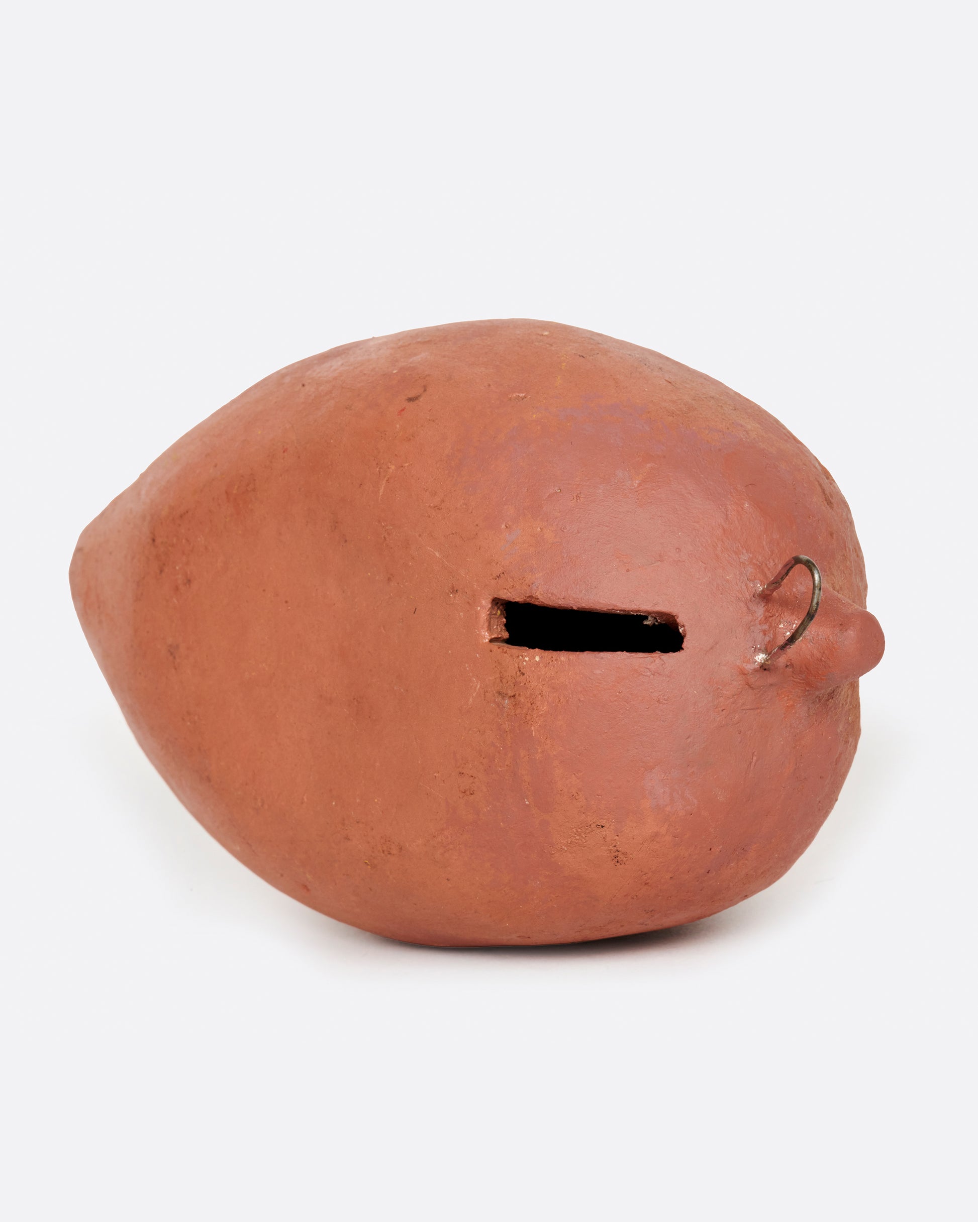 A vintage handmade sapote bank from 1940's Mexico.