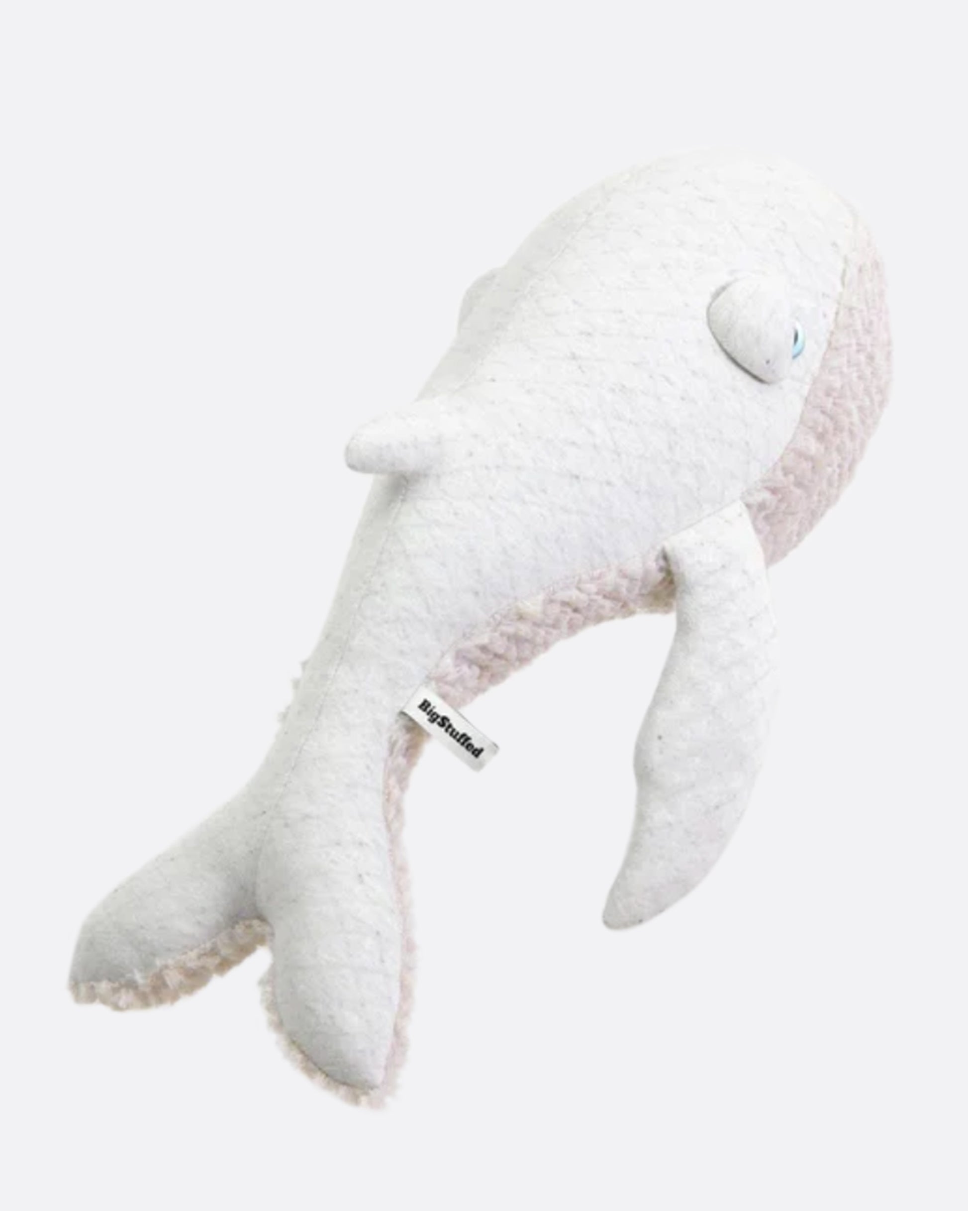 A light colored, wide-eyed whale to snuggle.