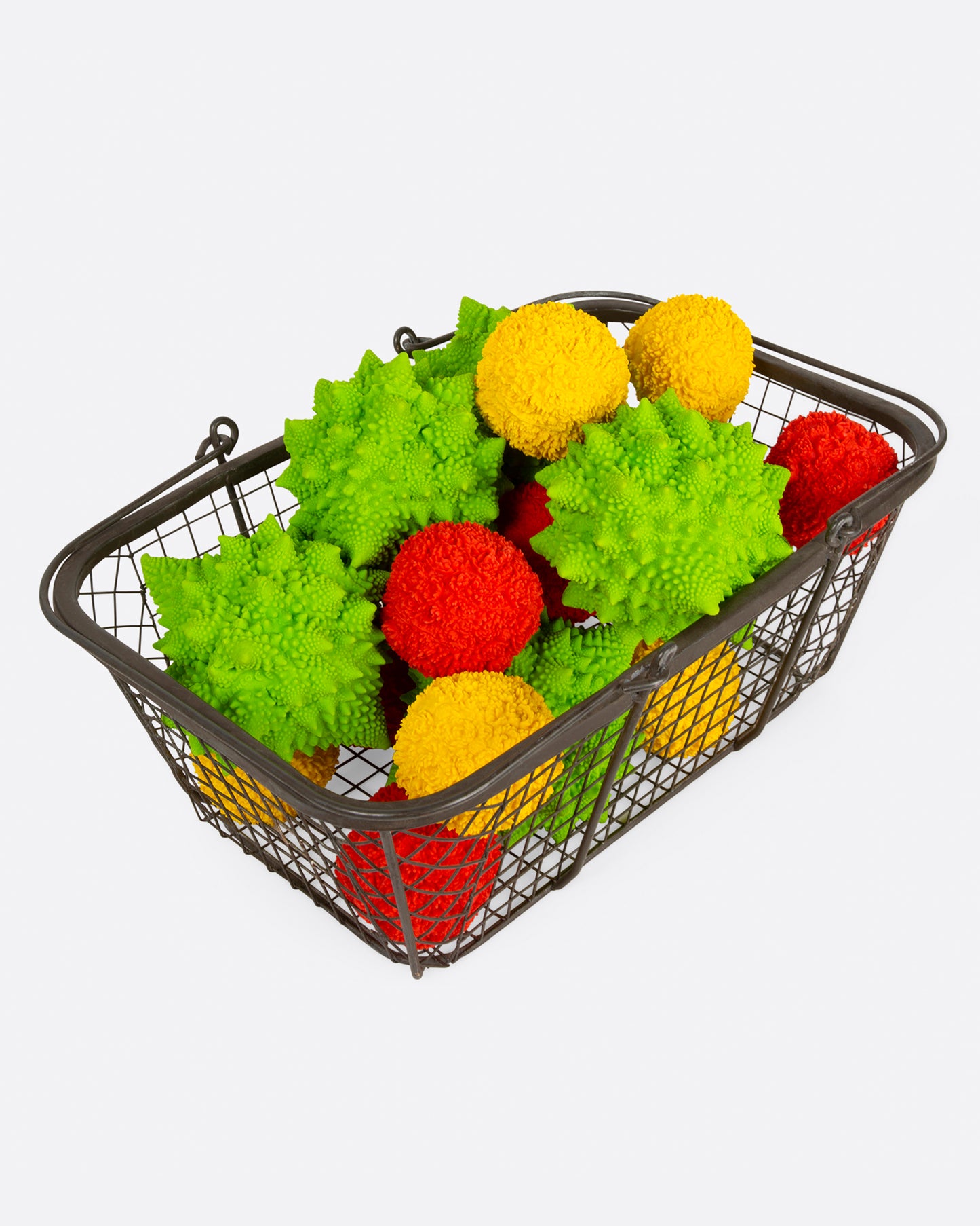 A wire basket filled with dog toys