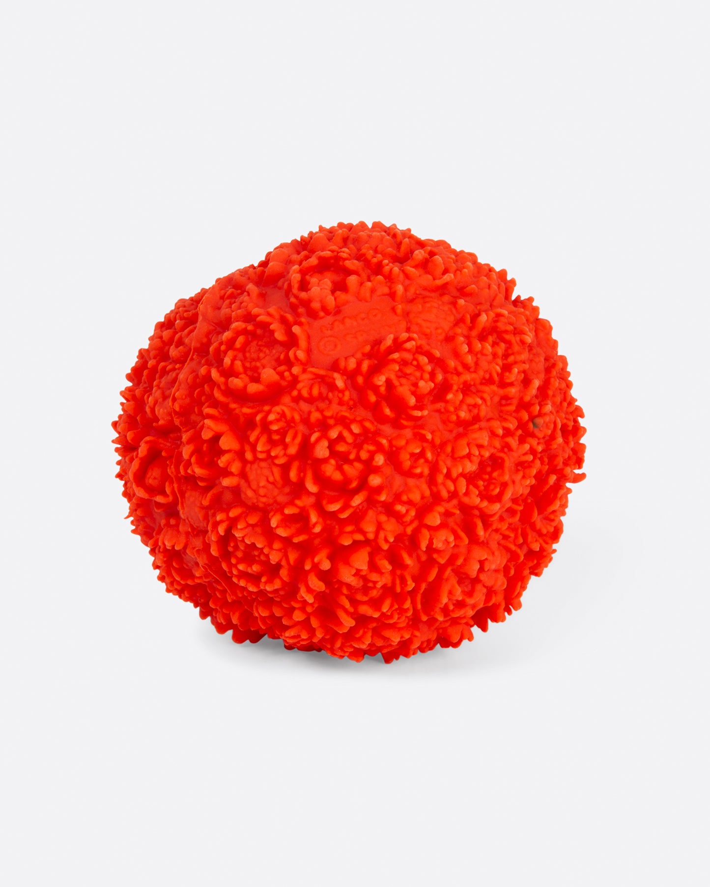 Side view of red flower ball dog toy