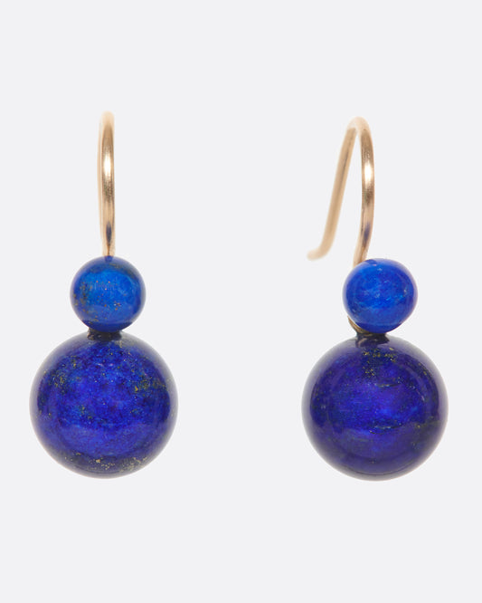 Two natural lapis spheres hang to create a contemporary geometric earring. Each pair is slightly different, as malachite has variations in its color naturally. 