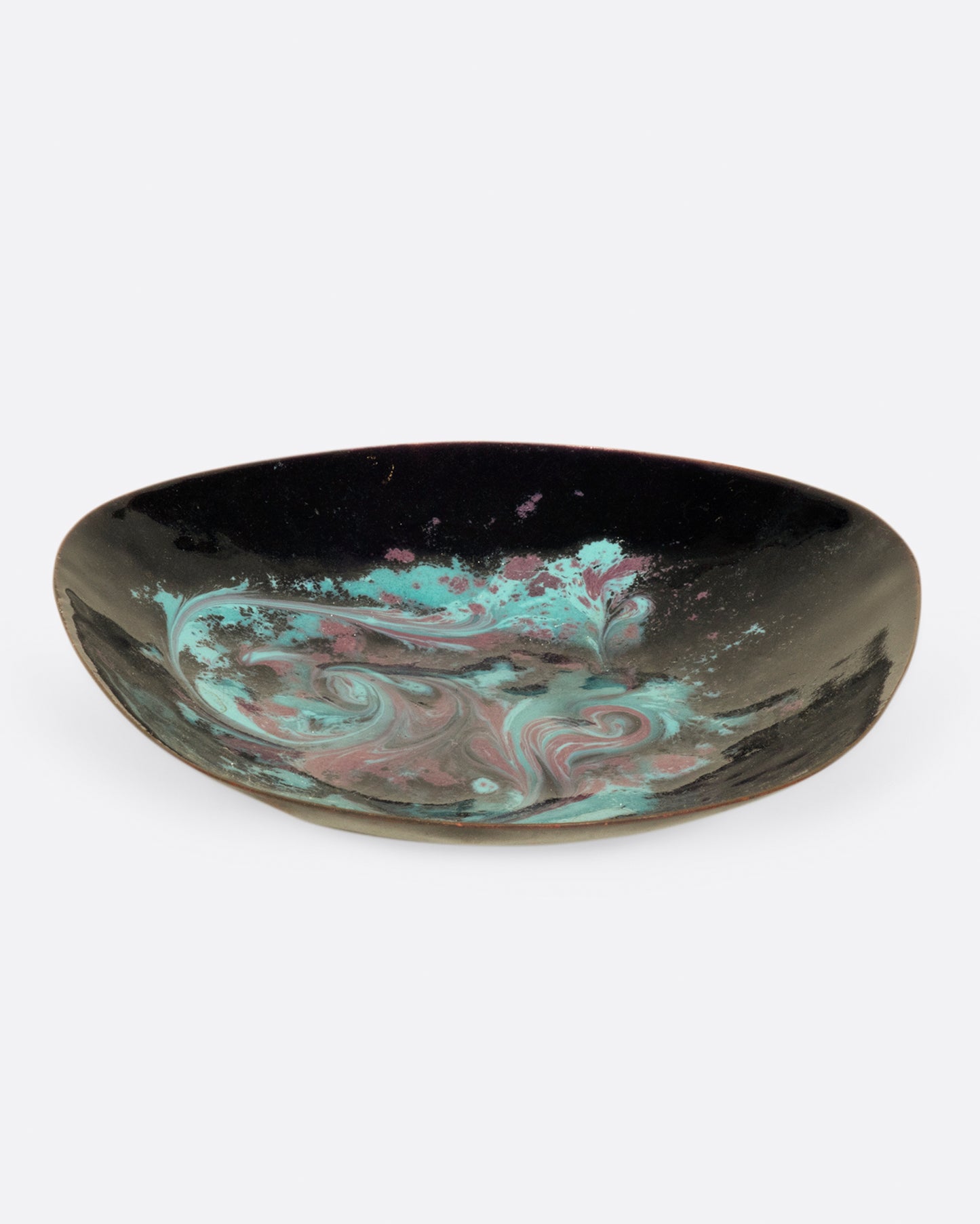 A metal dish, tapered at one side, coated in swirled pink and blue enamel.