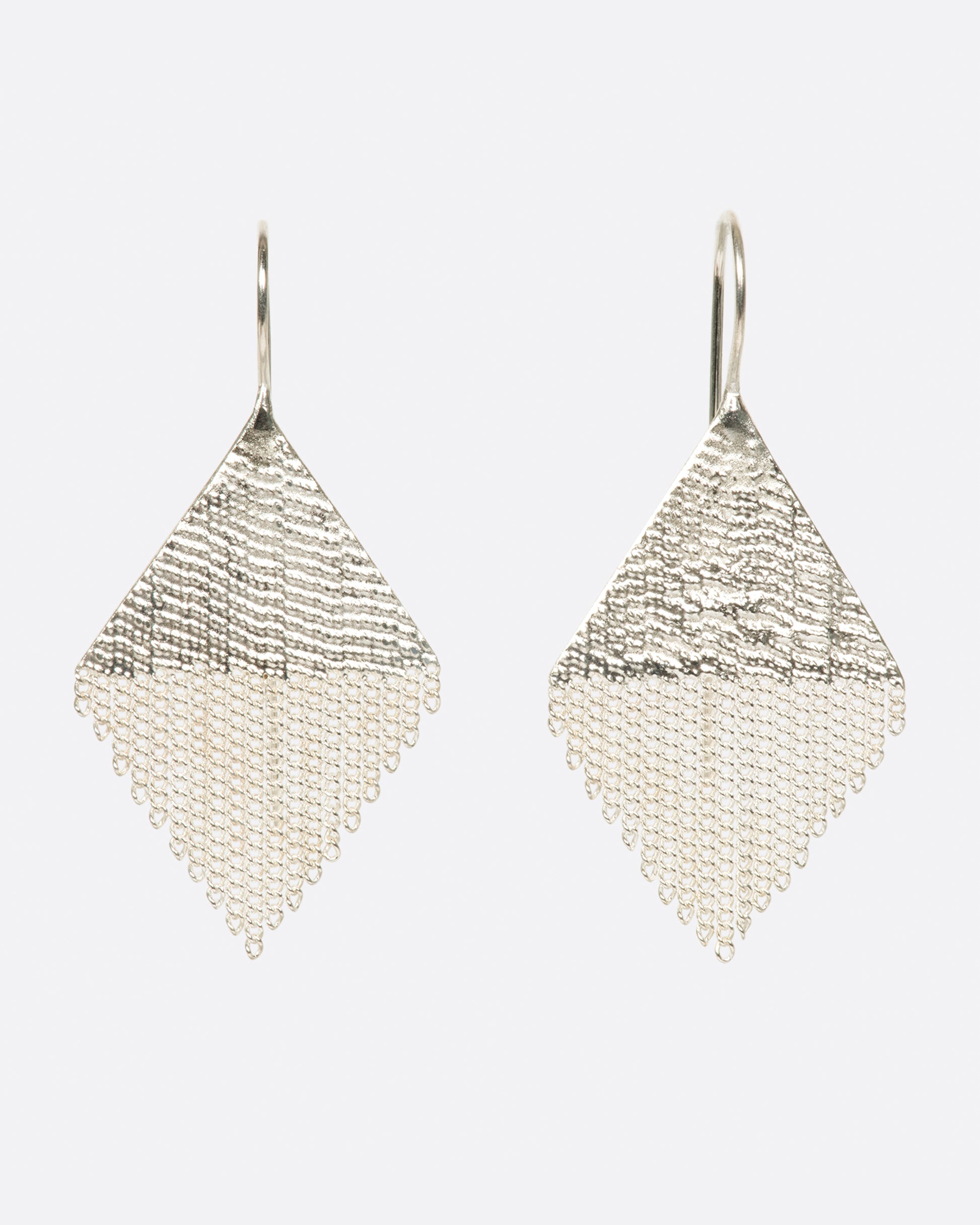 A pair of diamond shaped drop earrings made from sterling silver chains and silver solder. Shown from the front.