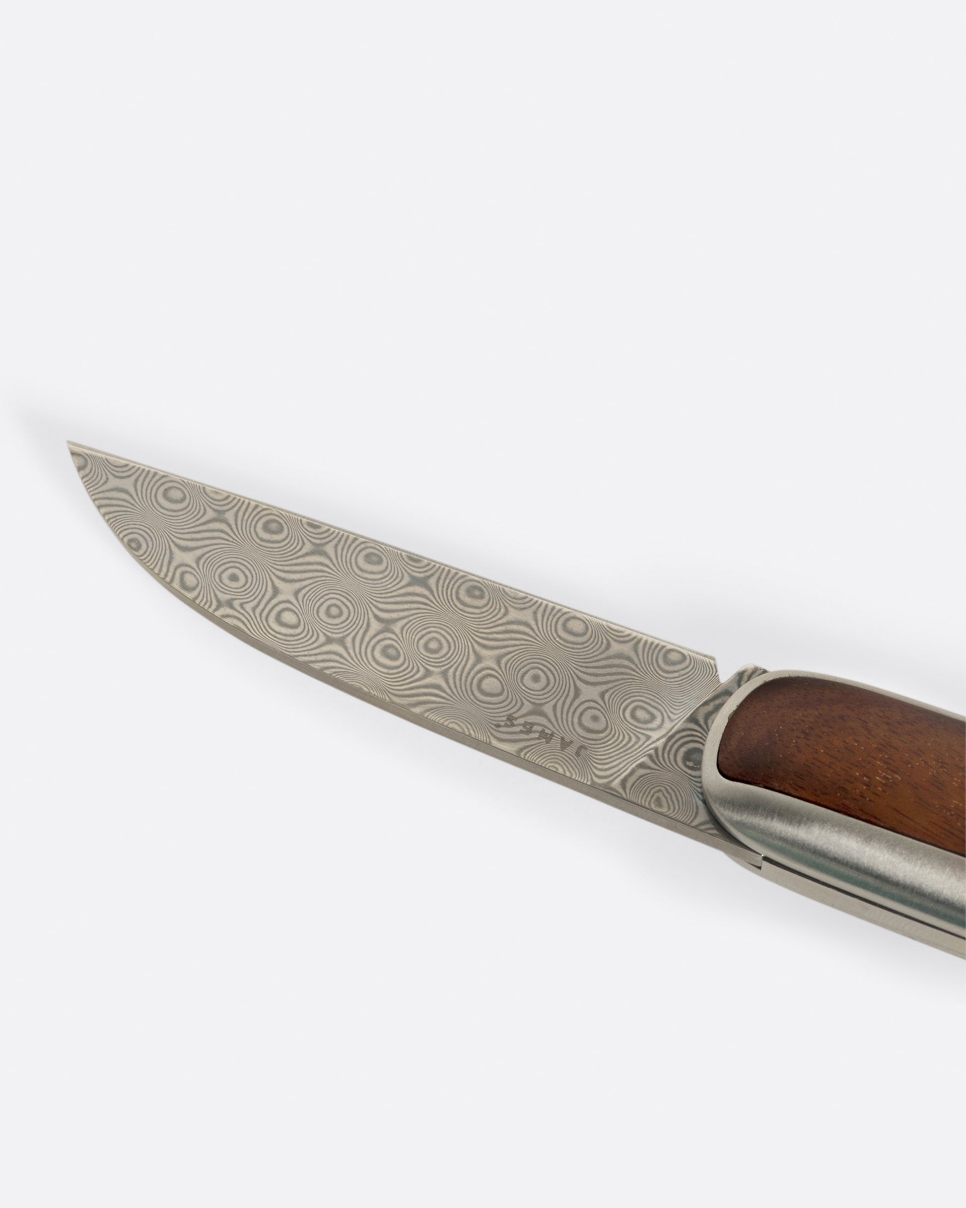 A pocket knife with a rosewood handle and damasteel blade.