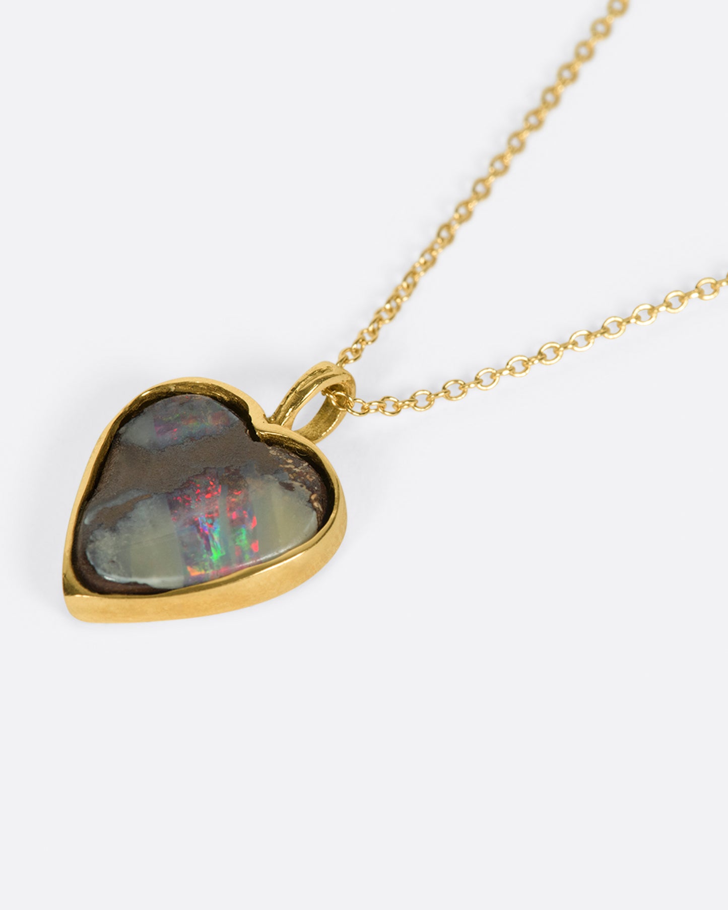 A heart shaped Australian opal pendant with loads of flash.