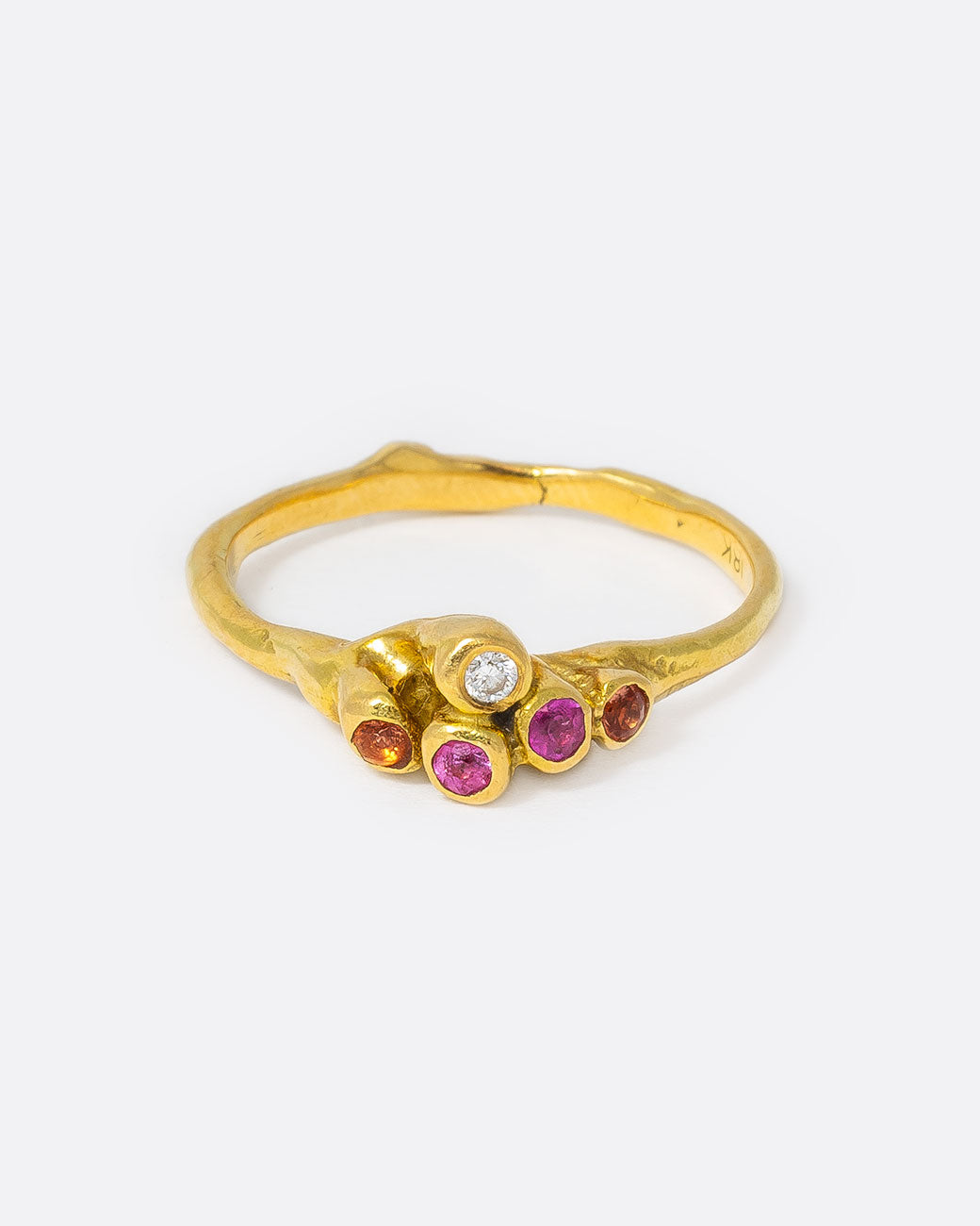 18k yellow gold teeny sea anemone ring with pink sapphires, orange sapphires, and diamonds by Kimberlin Brown, shown from the front.