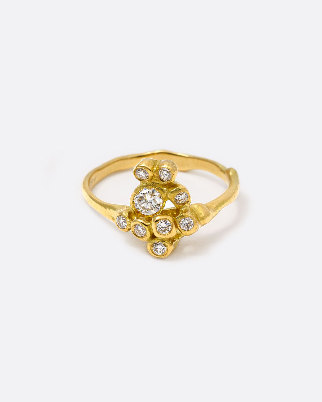 18k yellow gold blooming anemone ring with nine round diamonds by Kimberlin Brown, shown from the front.