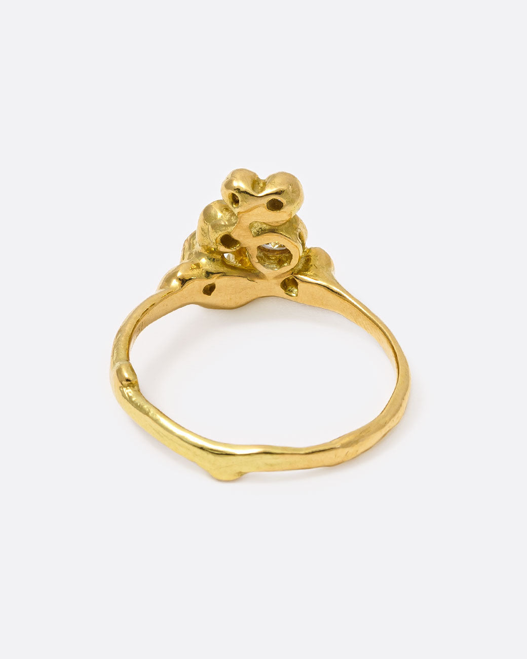 18k yellow gold blooming anemone ring with nine round diamonds by Kimberlin Brown, shown from the back.