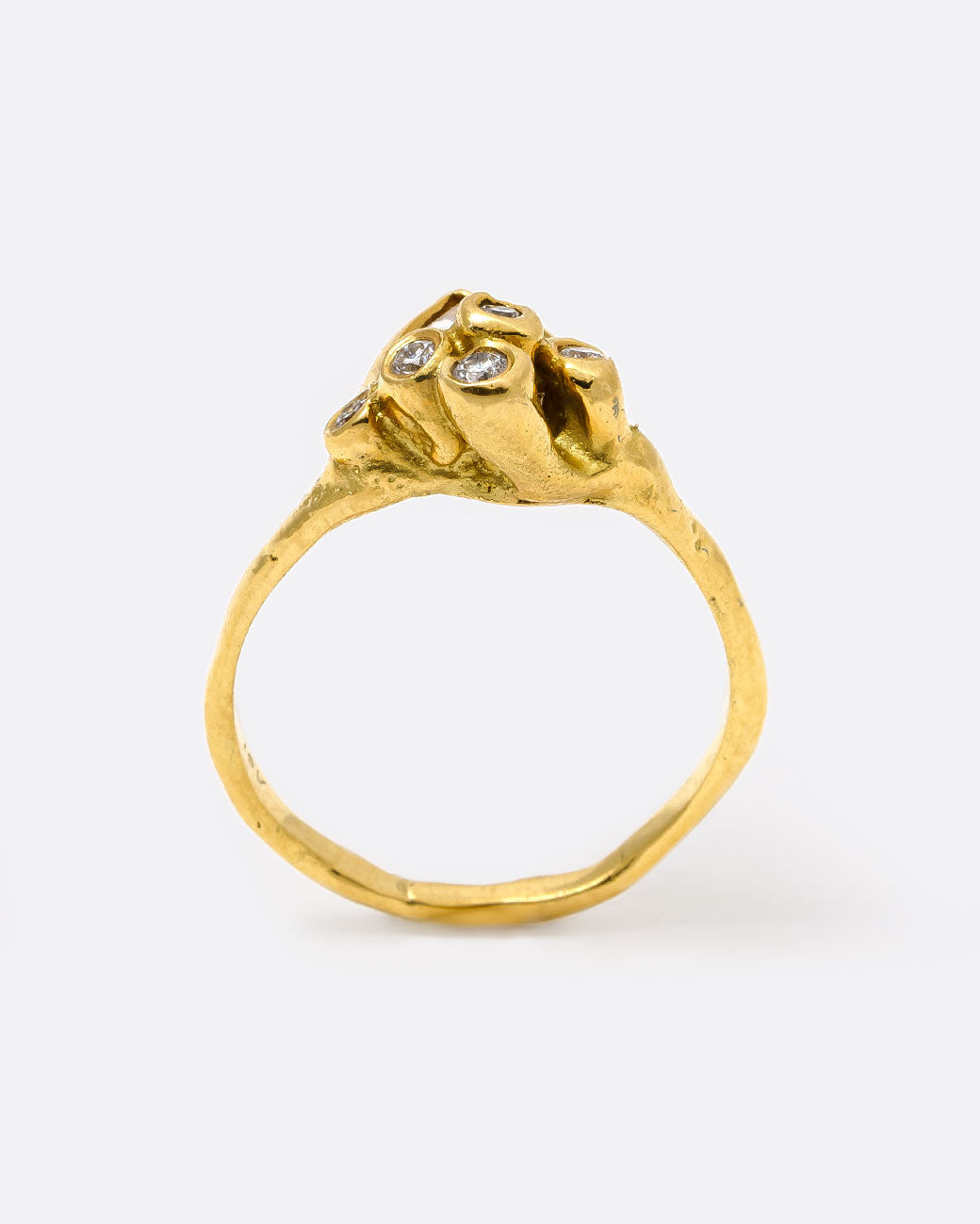 18k yellow gold anemone ring with triangular rose cut diamond and five round diamonds by Kimberlin Brown, shown from the side.