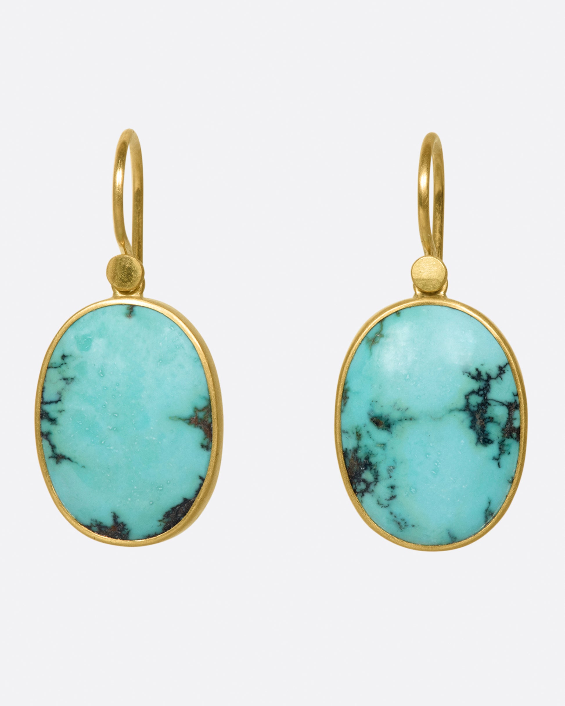 A pair of oval Tibetan turquoise drops set in Lola Brooks' signature bezel settings.