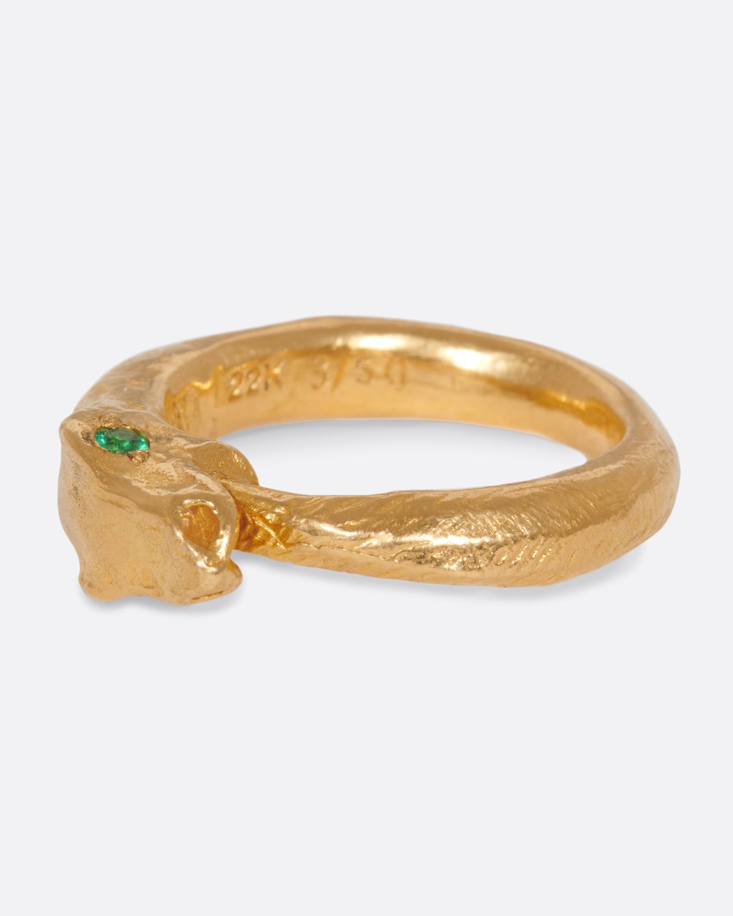 A high karat gold ouroboros ring showing a serpent catching its own tail.