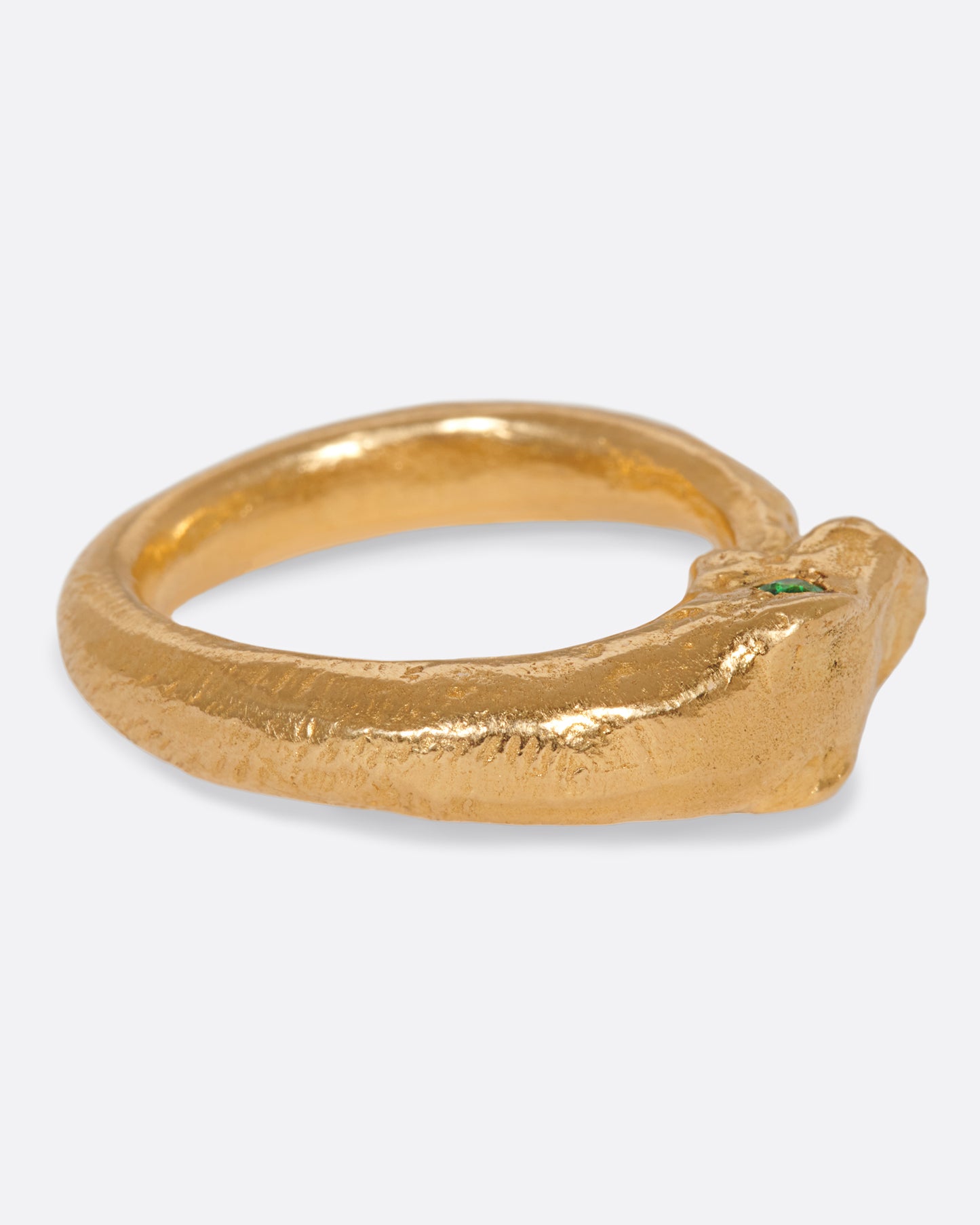 A high karat gold ouroboros ring showing a serpent catching its own tail.