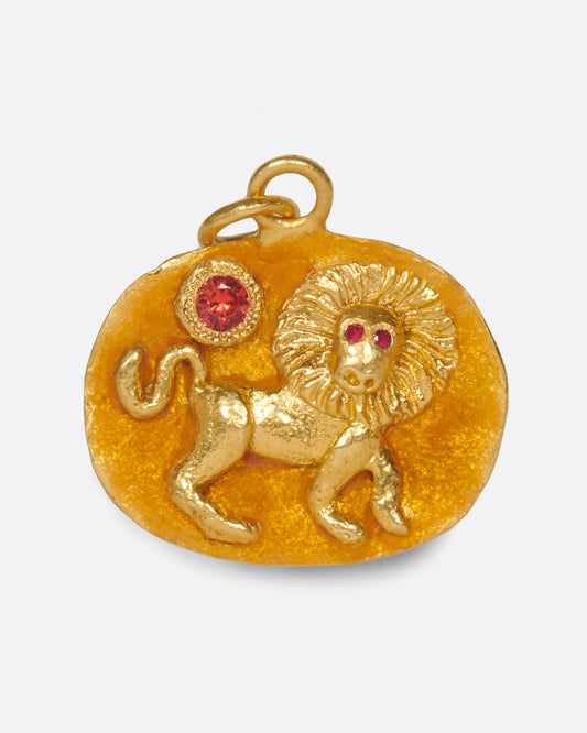 A high karat gold medallion with a hand-sculpted Leo icon with ruby eyes.