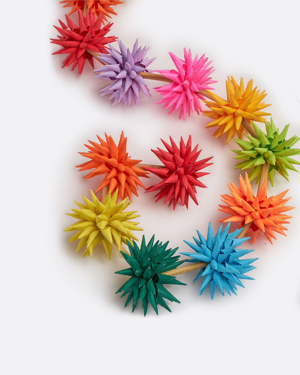 A multicolor paper starburst garland, shown from above.