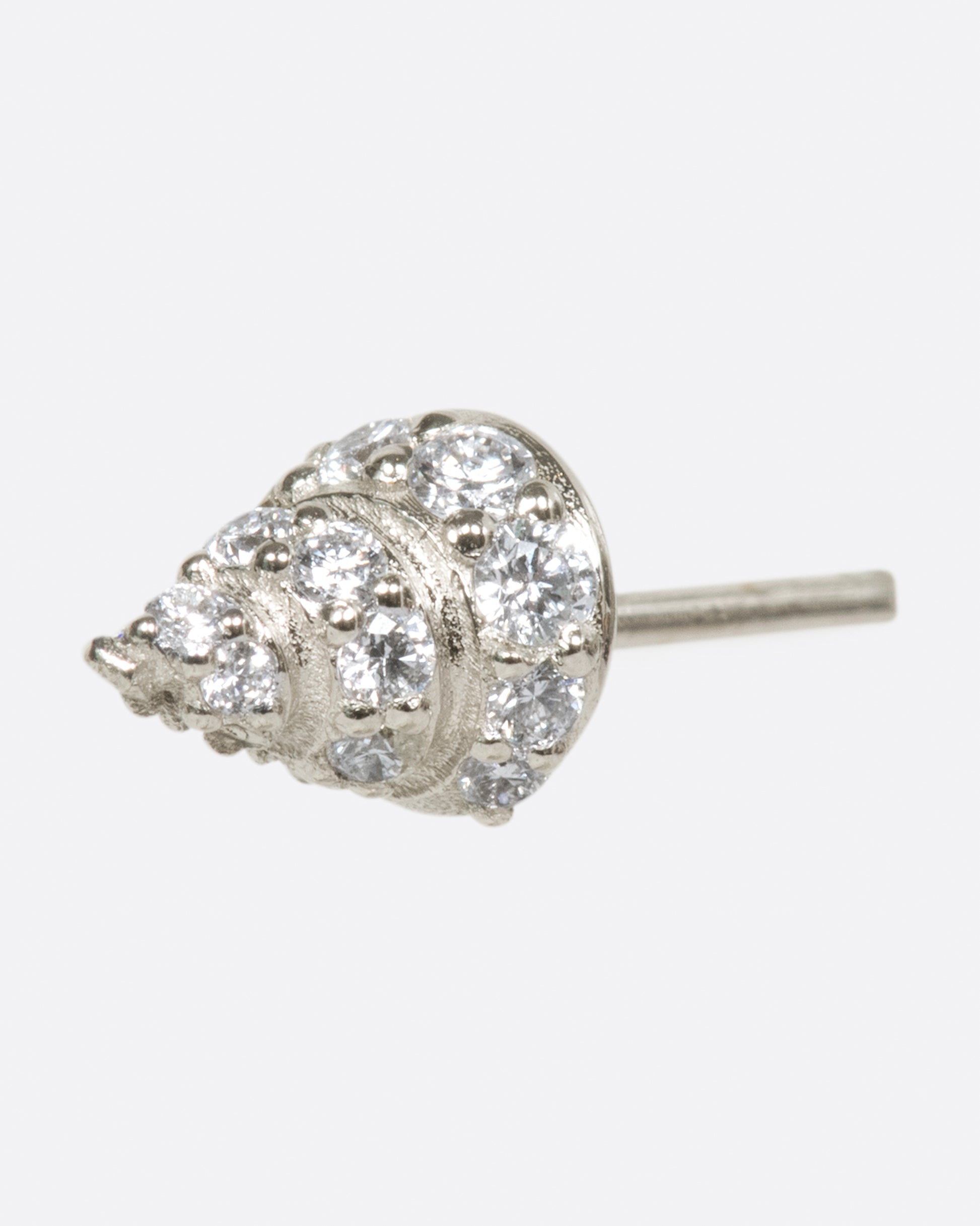 A pointed stud, in your choice of gold, with diamonds wrapped around it.