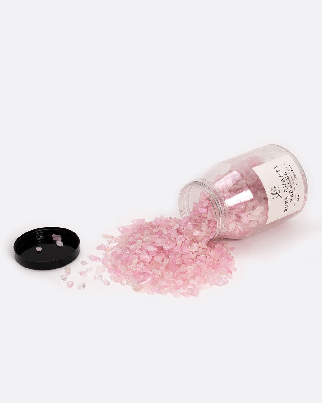 Rose quartz plant pebbles, shown spilling out of jar.