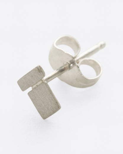 Silver square and bar stud earring, side view showing the post