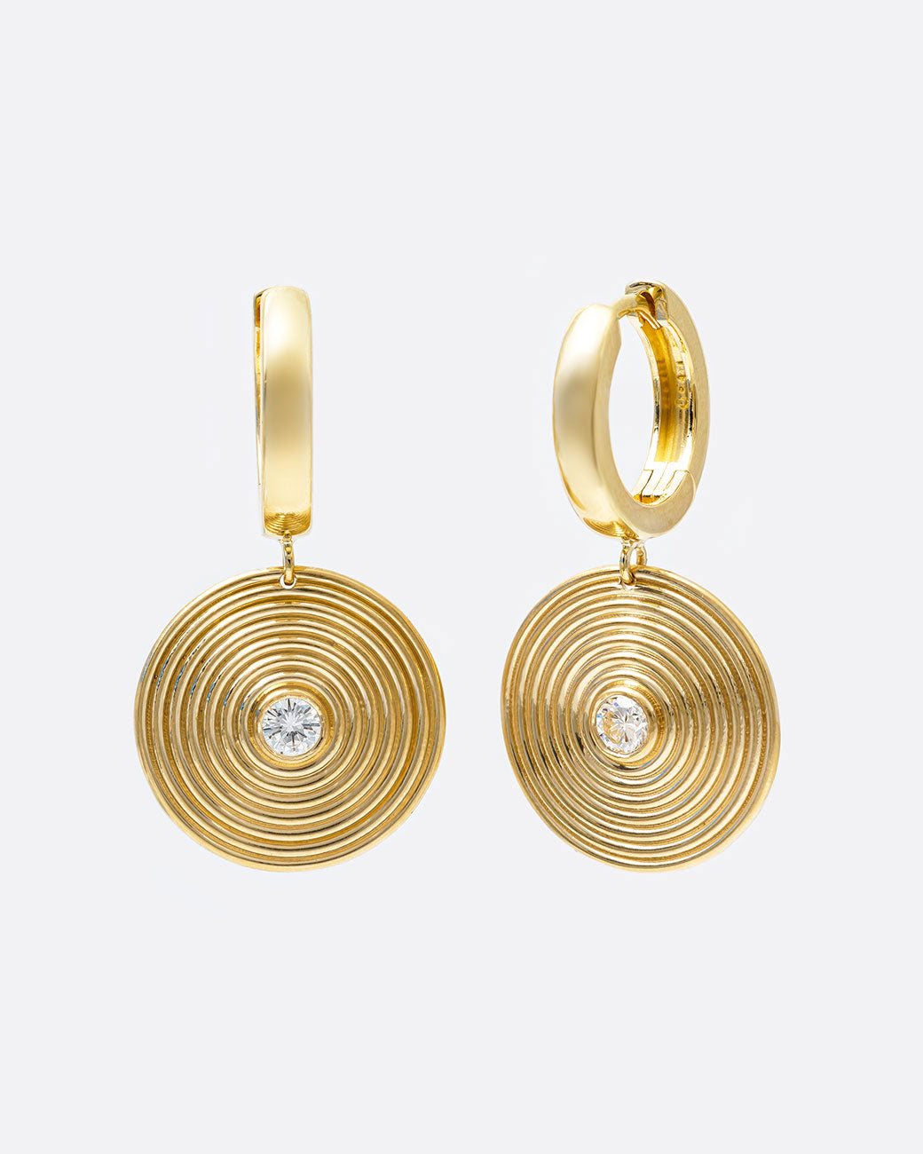 14k yellow gold hoop earrings with round ribbed diamond drops by Selin Kent, shown from the side.