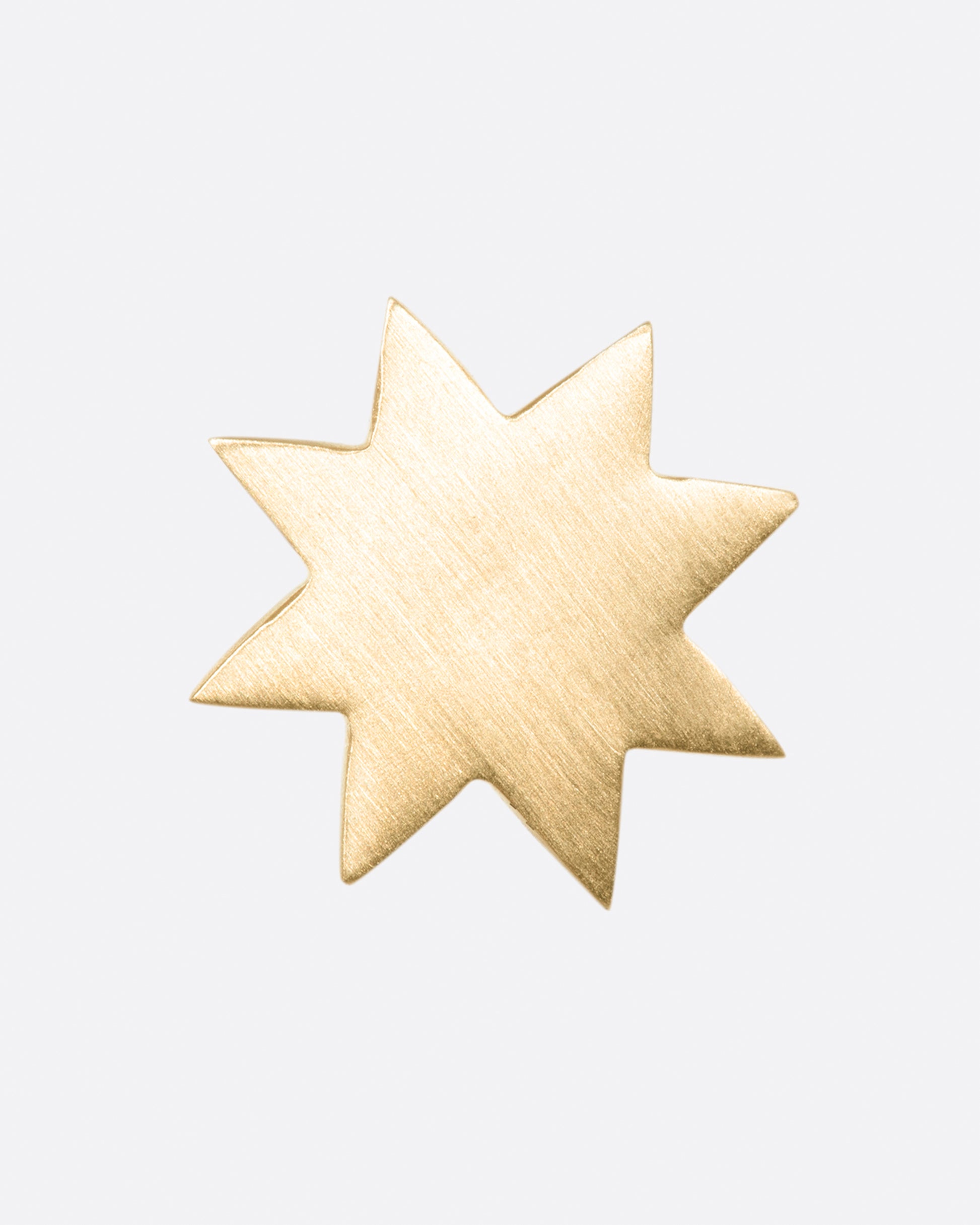 A round, matte star earring; perfectly paired with another star of a different color.