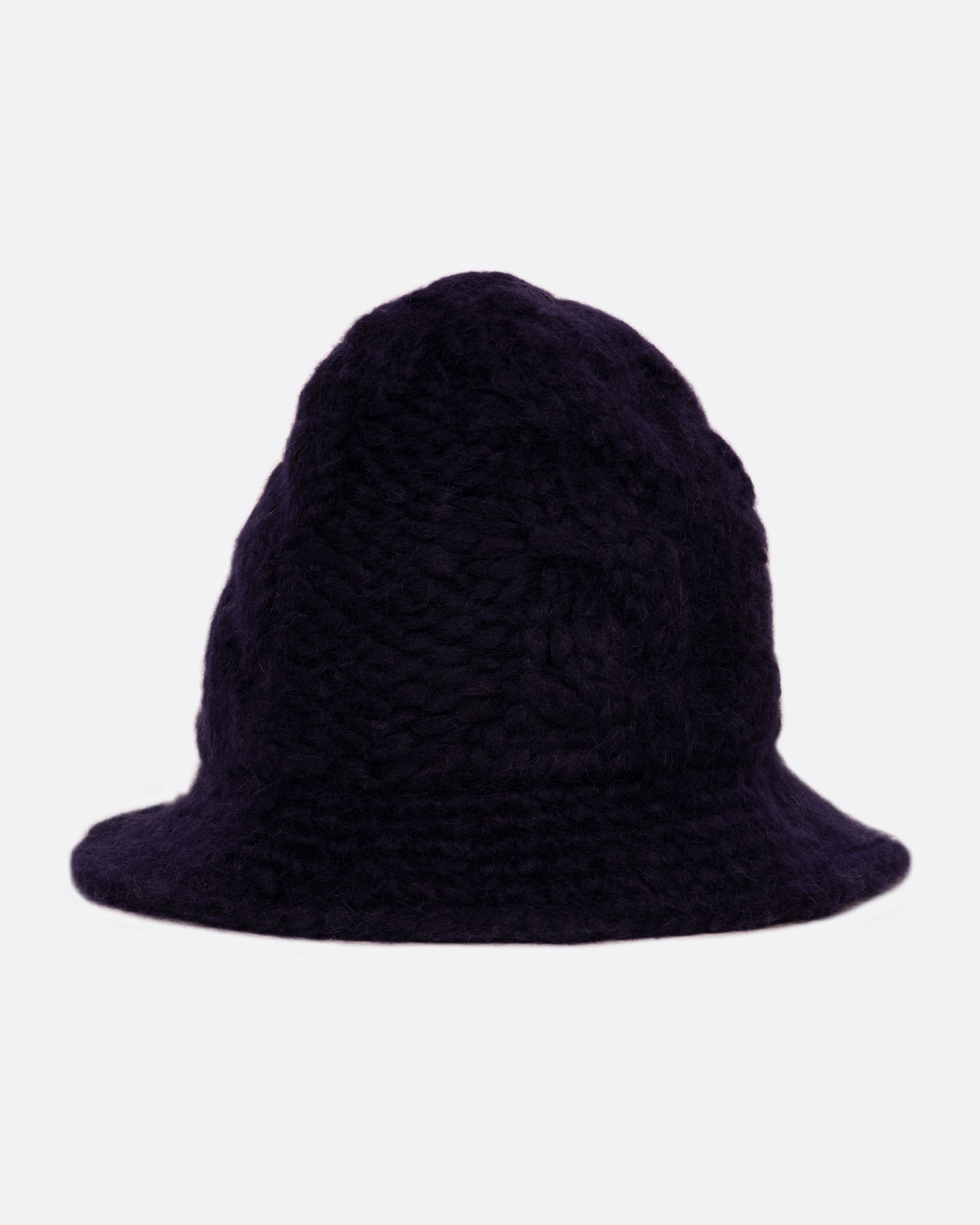 A chunky cable knit bucket hat with a narrow brim.