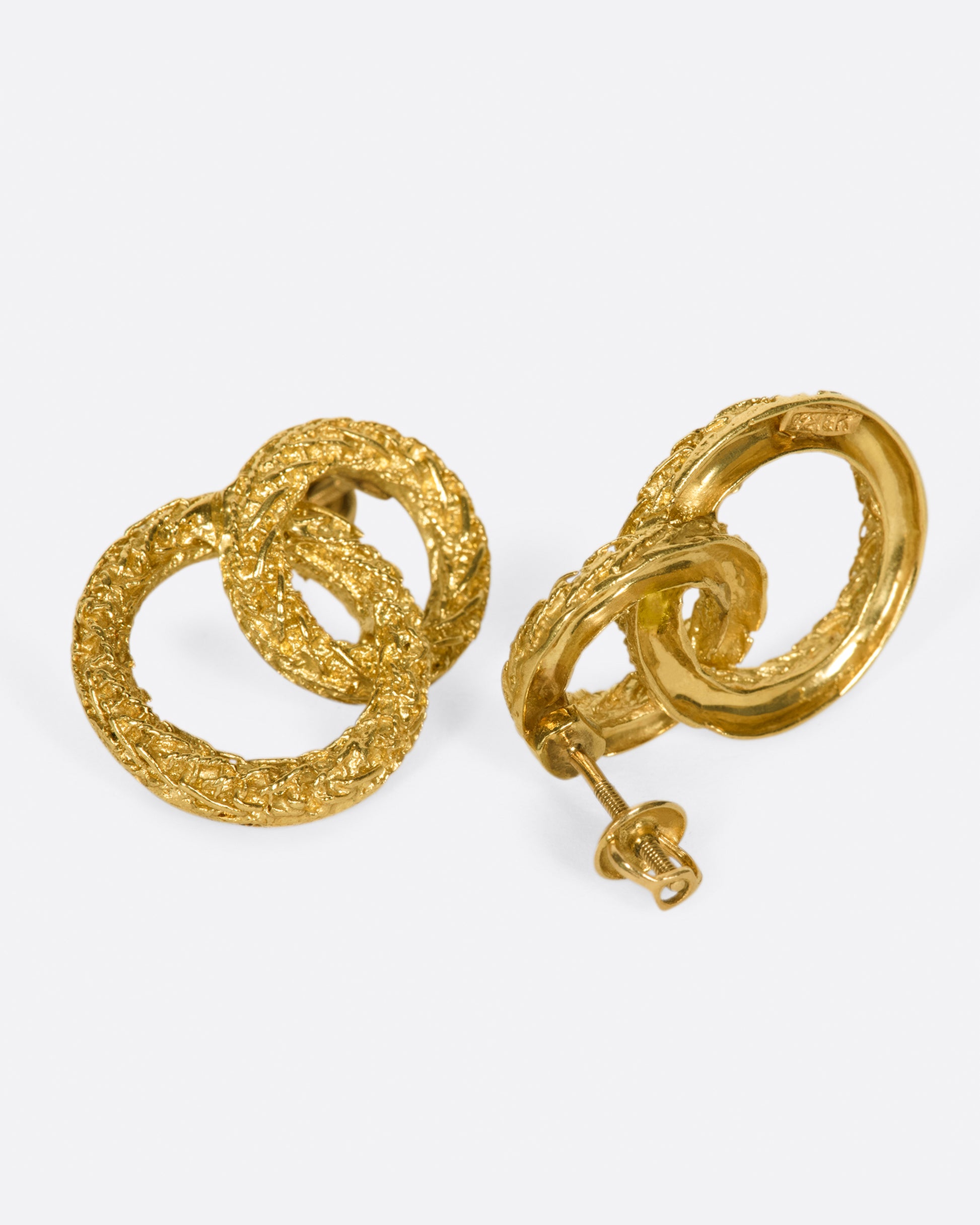 A pair of textured double-circle stud earrings for an impactful look.